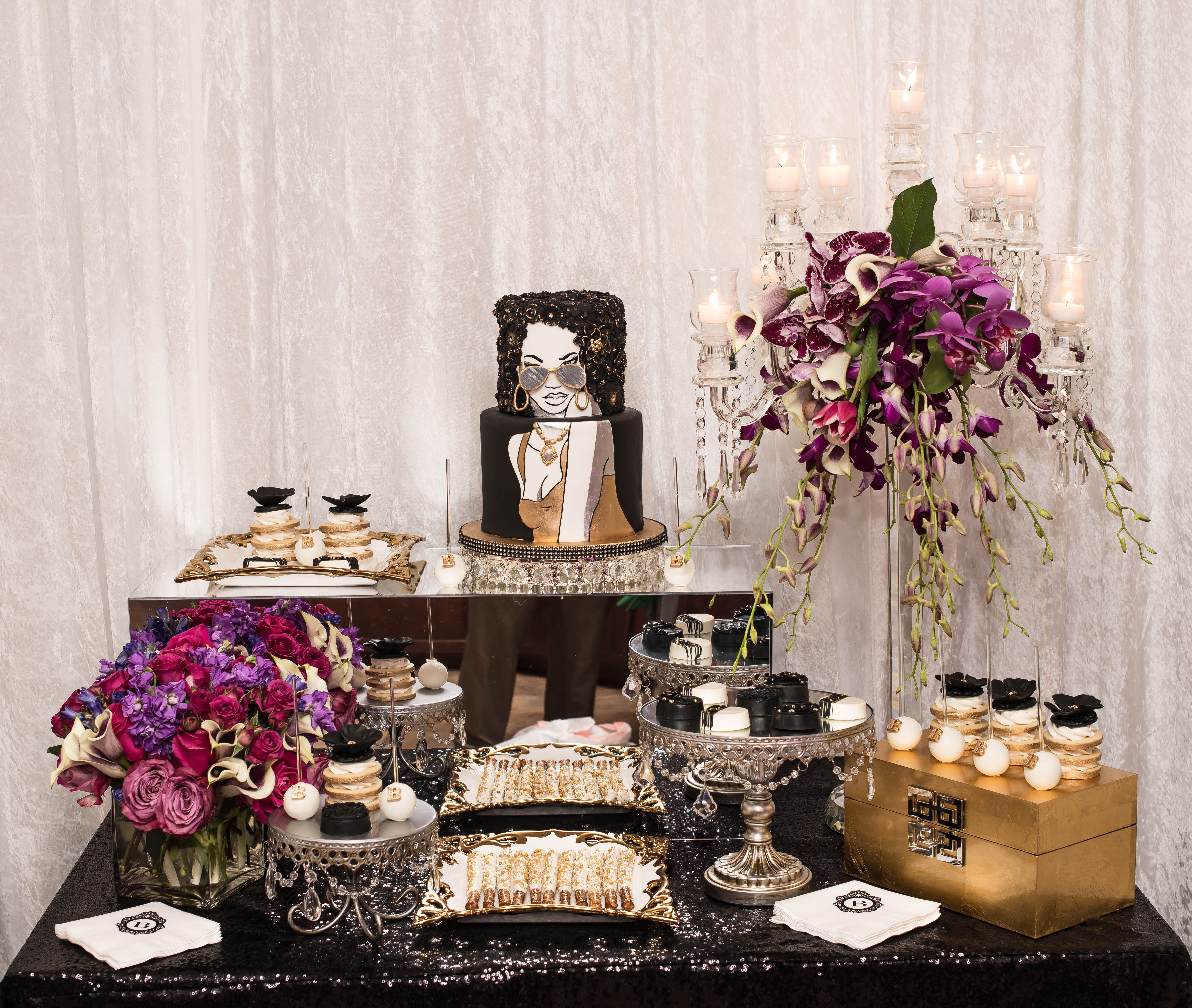 black and magenta dessert table with hand-painted portrait cake